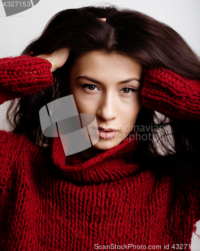 Image of young pretty woman in sweater and scarf all over her face, lifestyle people winter concept