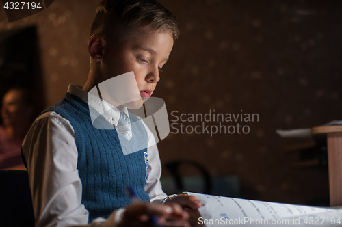 Image of pupil boy does his homework