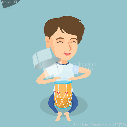 Image of Young caucasian woman playing the ethnic drum.
