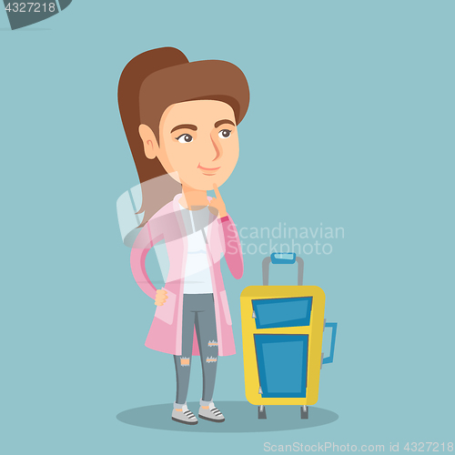 Image of Caucasian woman with suitcase waiting for a flight