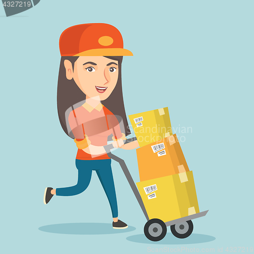 Image of Woman-postman pushing the trolley with parcels.