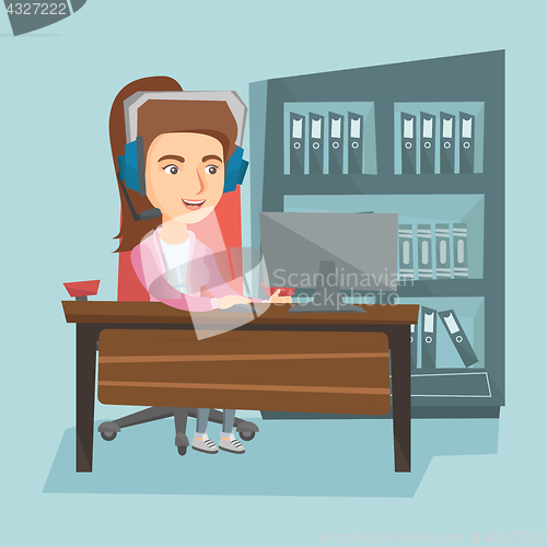 Image of Business woman with headset working in the office.