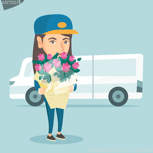 Image of Delivery courier holding bouquet of flowers.