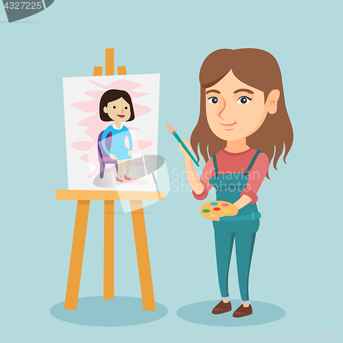 Image of Young caucasian artist painting a portrait.