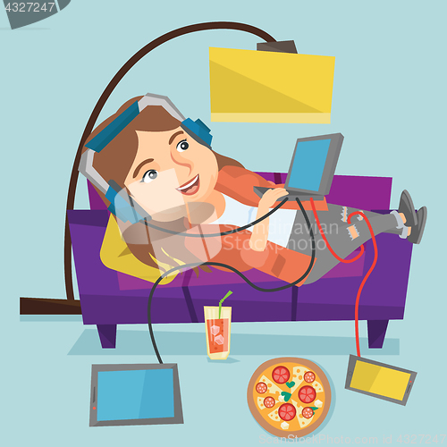 Image of Caucasian fat woman lying on sofa with gadgets.