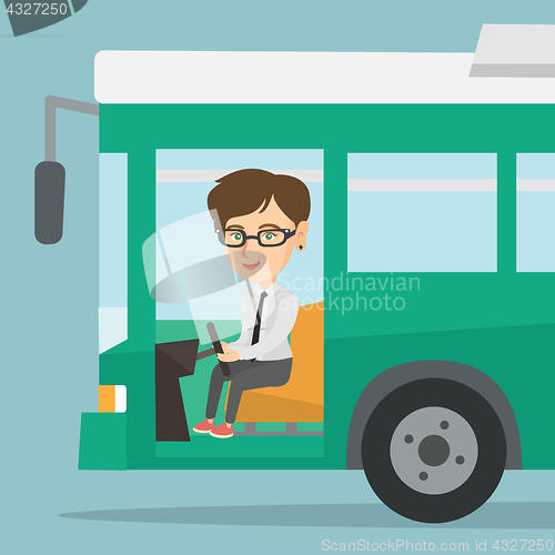 Image of Caucasian bus driver sitting at steering wheel.