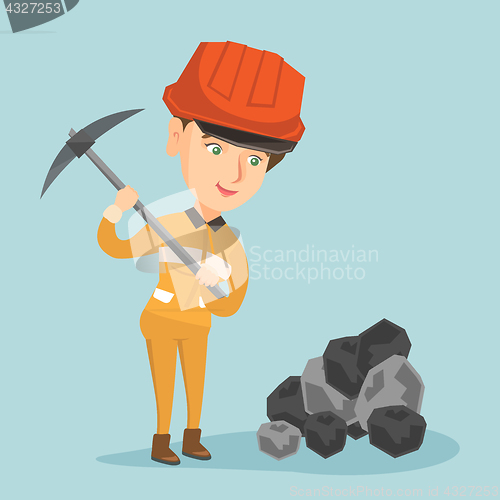 Image of Caucasian miner in hard hat working with a pickaxe