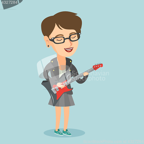 Image of Young caucasian woman playing the electric guitar.