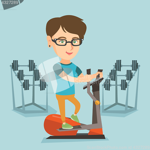 Image of Caucasian woman exercising on elliptical trainer.