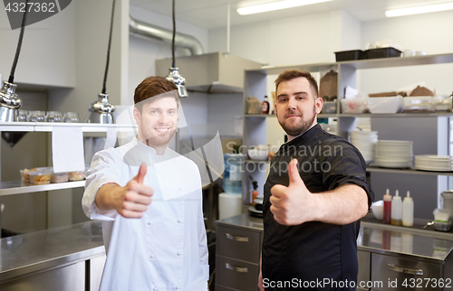 Image of chefs at restaurant kitchen showing thumbs up