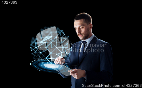 Image of businessman with tablet pc and low poly projection