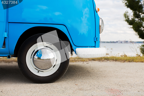 Image of close up of hippie minivan car at seaside