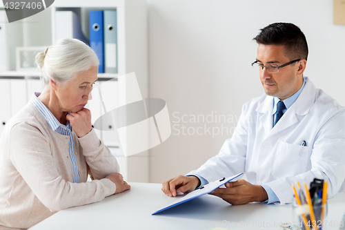 Image of senior woman and doctor meeting at hospital