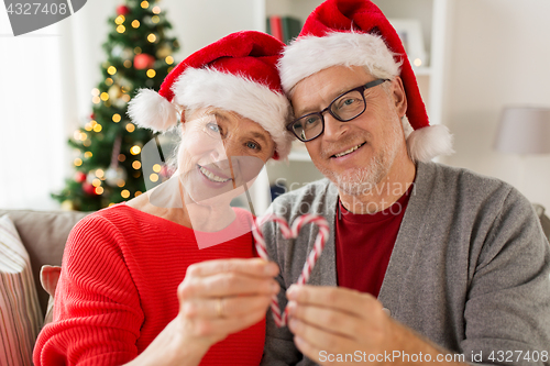 Image of close up of happy senior couple at christmas