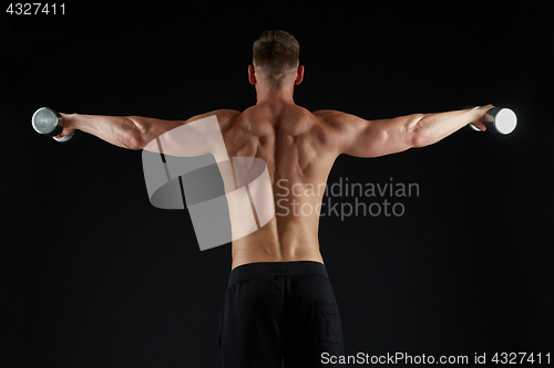 Image of man with dumbbells exercising