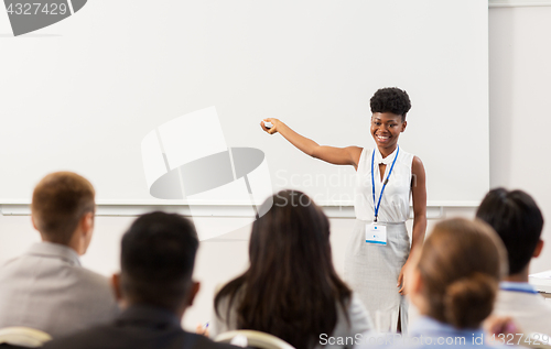 Image of group of people at business conference or lecture