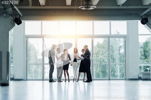 Image of business people with tablet pc computers at office