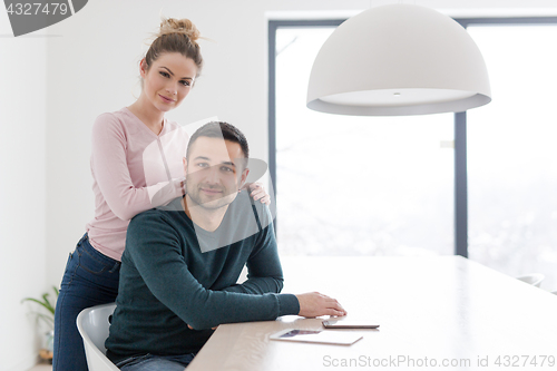 Image of couple hugging in their new home