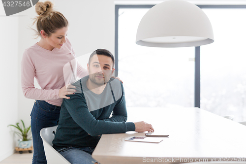 Image of couple hugging in their new home