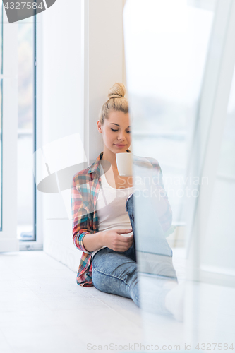 Image of Portrait of a beautiful girl on the floor