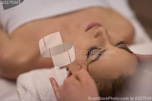 Image of woman receiving a head massage