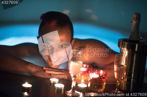 Image of man relaxing in the jacuzzi