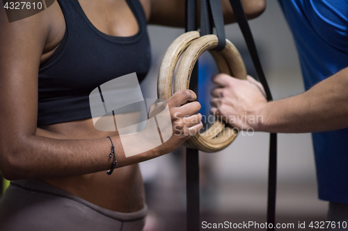 Image of Portrait of multiethnic couple  after workout at gym