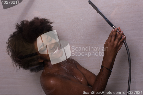 Image of African American woman in the shower