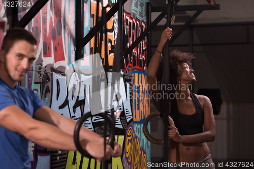 Image of Portrait of multiethnic couple  after workout at gym