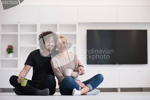 Image of young couple in their new home