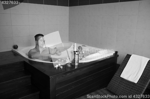 Image of man relaxing in the jacuzzi