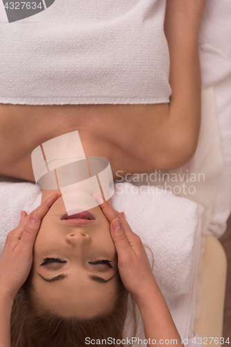 Image of woman receiving a head massage