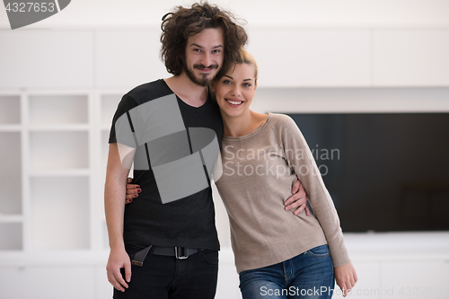 Image of couple hugging in their new home