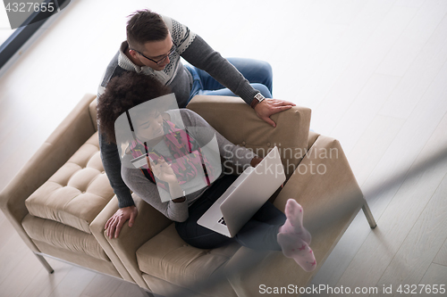 Image of multiethnic couple shopping online