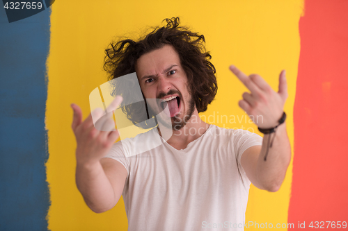 Image of young man with funny hair over color background