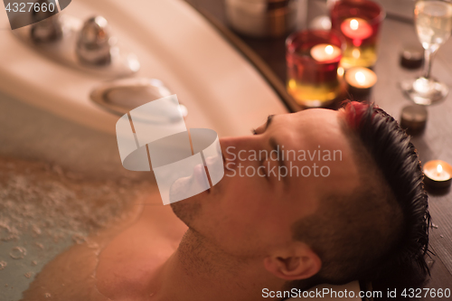 Image of man relaxing in the jacuzzi