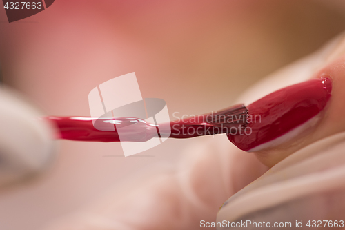 Image of Woman hands receiving a manicure