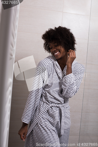 Image of beautiful black woman wearing  bathrobe