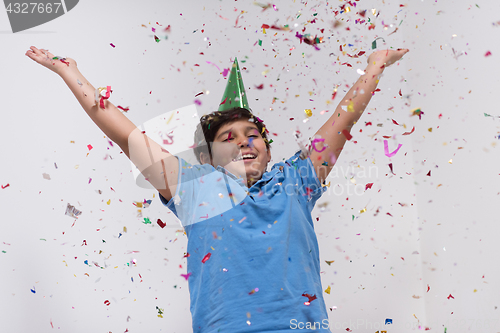 Image of kid blowing confetti