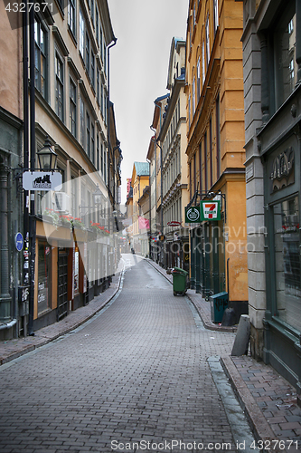 Image of STOCKHOLM, SWEDEN - AUGUST 20, 2016: View of narrow street and c