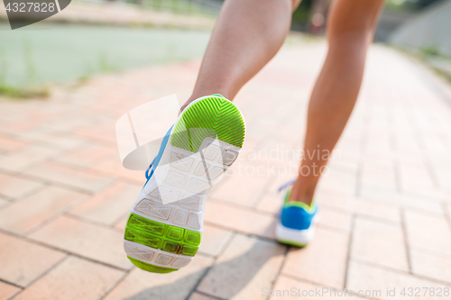 Image of Woman running in a urban city