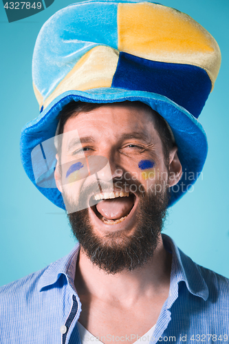 Image of The football fan over blue