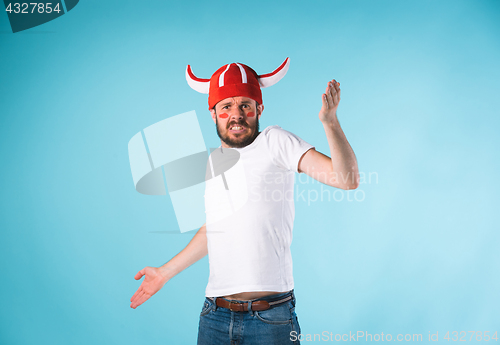 Image of The football fan over blue