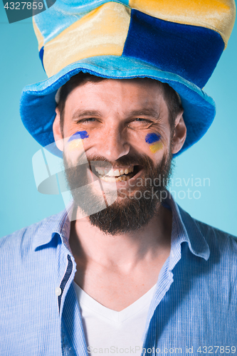 Image of The football fan over blue