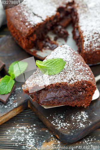 Image of Piece of chocolate cake dusted with powdered sugar.