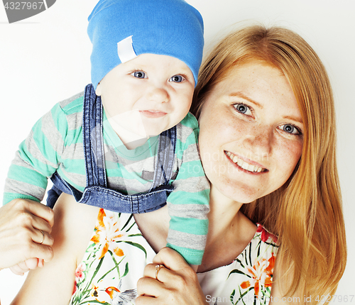 Image of young beauty mother with cute baby, red head happy modern family