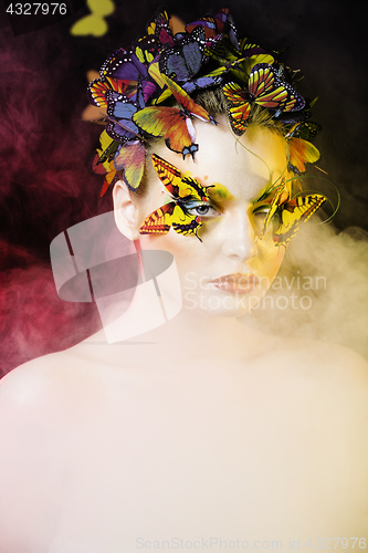 Image of woman with summer creative make up like fairy butterfly closeup 