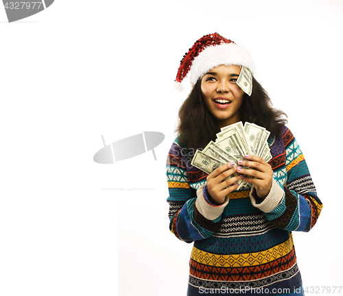 Image of cute young girl in santas red hat with money isolated