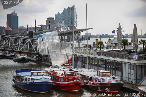 Image of HAMBURG, GERMANY - AUGUST 22, 2016: Boats and people at the port