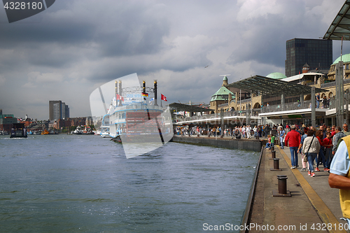 Image of HAMBURG, GERMANY - AUGUST 22, 2016: Boats and people at the port